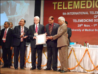 Prof Ganapathy receiving a special felicitation from the Telemedicine Society of India during its annual conference at Jaipur Nov 13